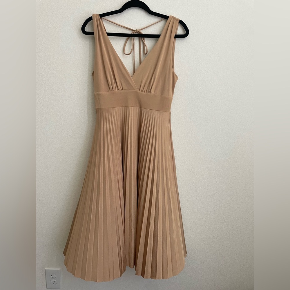 eyelash couture gold pleated dress with low v neck and cowl back